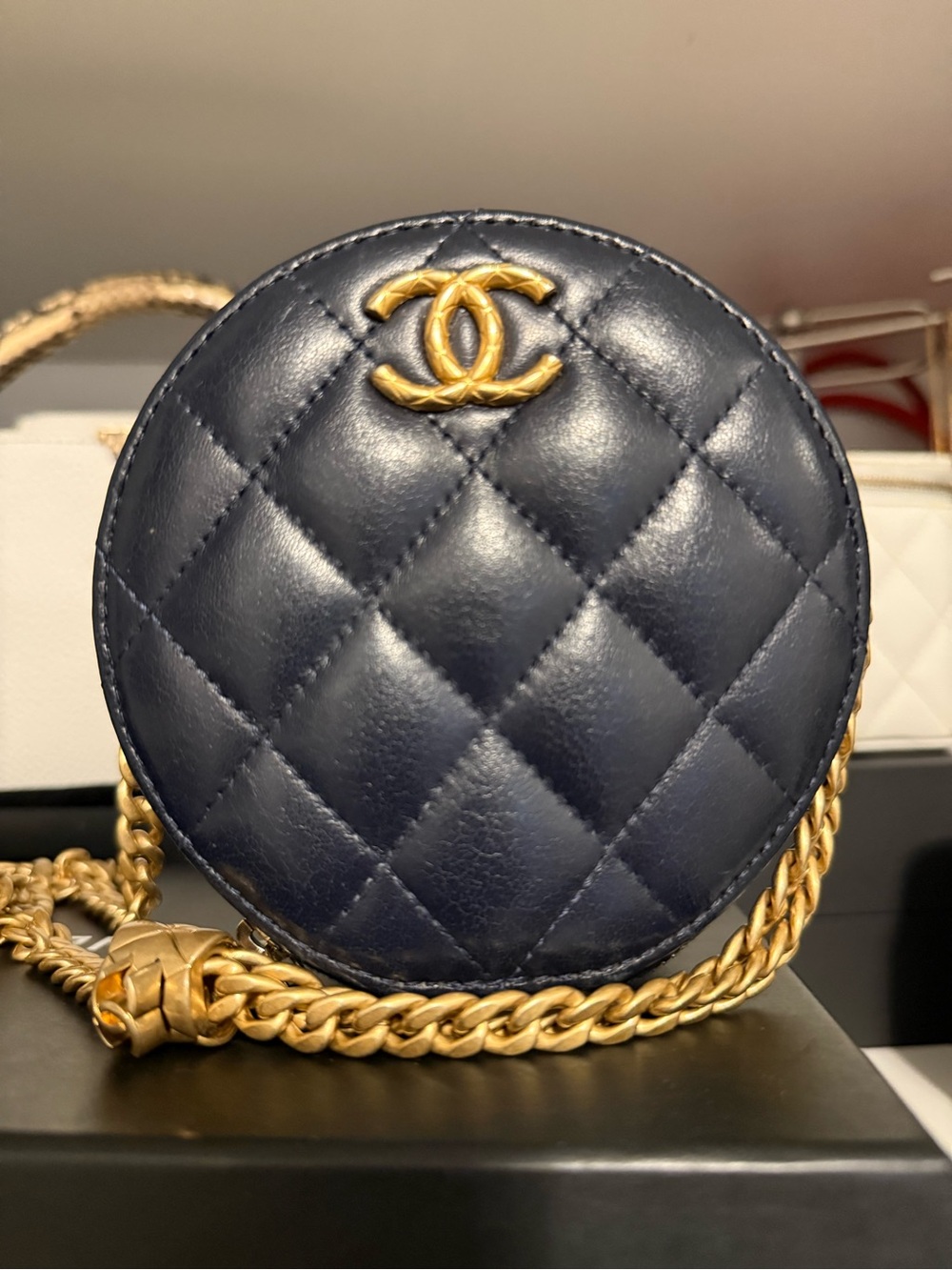 CHANEL Mini Round Quilted Leather Crossbody - Navy with Gold